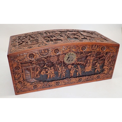 1137 - A Chinese camphorwood chest with dome top, carved oriental scenes, 90cm wide