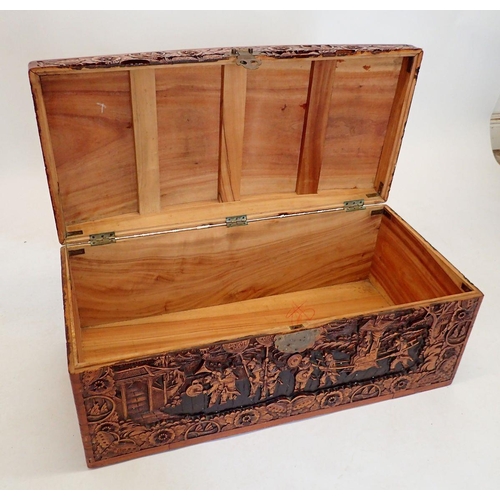 1137 - A Chinese camphorwood chest with dome top, carved oriental scenes, 90cm wide