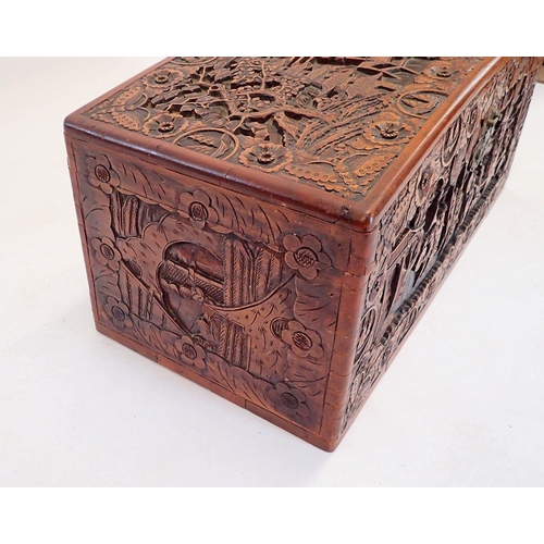 1137 - A Chinese camphorwood chest with dome top, carved oriental scenes, 90cm wide