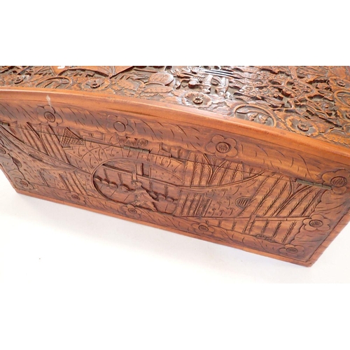 1137 - A Chinese camphorwood chest with dome top, carved oriental scenes, 90cm wide