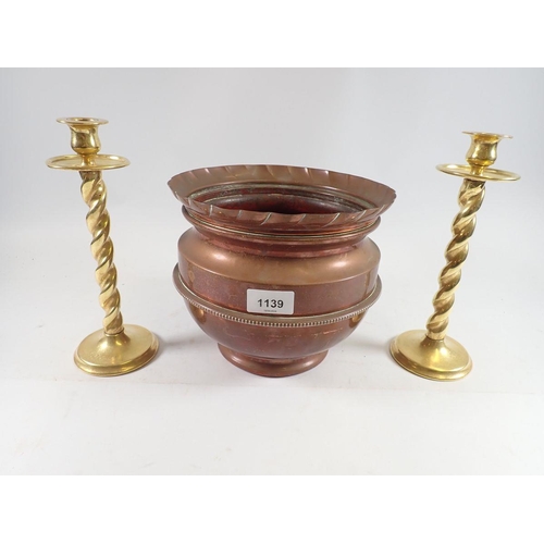 1139 - A pair of brass wrythen twist candlesticks, 25cm and copper jardiniere