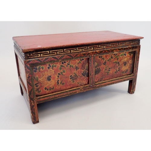 1140 - A small Chinese red painted wooden chest with floral decoration, secret door to reverse, 75 x 38 x 4... 