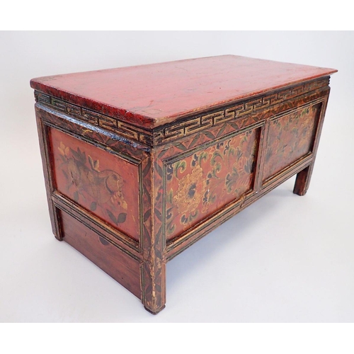 1140 - A small Chinese red painted wooden chest with floral decoration, secret door to reverse, 75 x 38 x 4... 