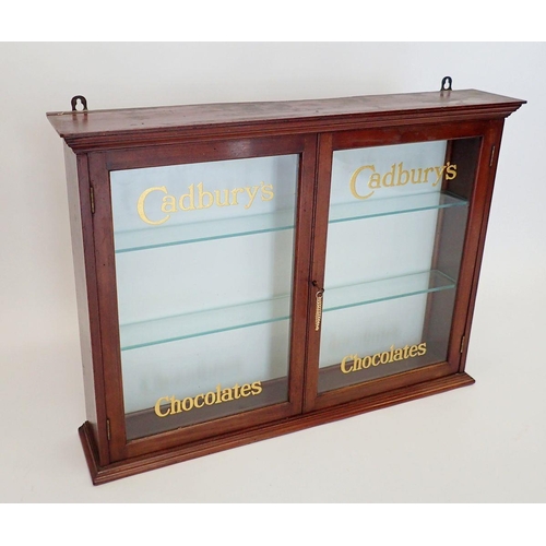 1148 - An Edwardian mahogany two door glazed Cadbury's Chocolate shop display cabinet with glass doors and ... 