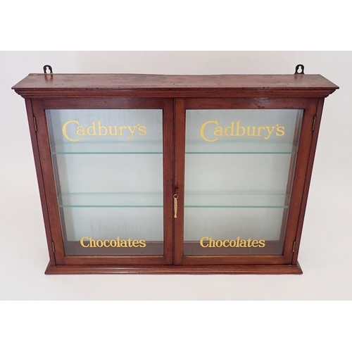 1148 - An Edwardian mahogany two door glazed Cadbury's Chocolate shop display cabinet with glass doors and ... 