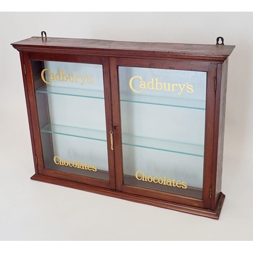 1148 - An Edwardian mahogany two door glazed Cadbury's Chocolate shop display cabinet with glass doors and ... 