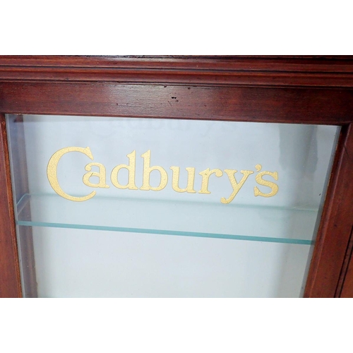 1148 - An Edwardian mahogany two door glazed Cadbury's Chocolate shop display cabinet with glass doors and ... 