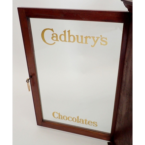 1148 - An Edwardian mahogany two door glazed Cadbury's Chocolate shop display cabinet with glass doors and ... 