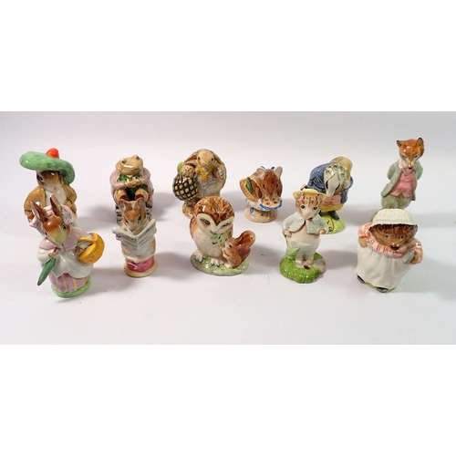 115 - A group of eleven Beswick Beatrix Potter figures, four with gold back stamps including Tommy Brock, ... 