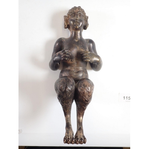 1154 - An antique bronze figure of a female faun seated (lacking base) 22cm tall