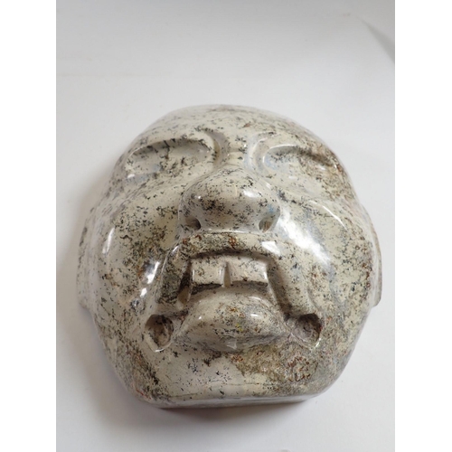 1160 - A pale stone carving of a face mask in Olmec style, 23 x 20cm