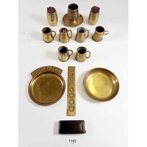 1162 - Various brass collectables including a Martin brass watch mainspring gauge, a brass match striker, t... 