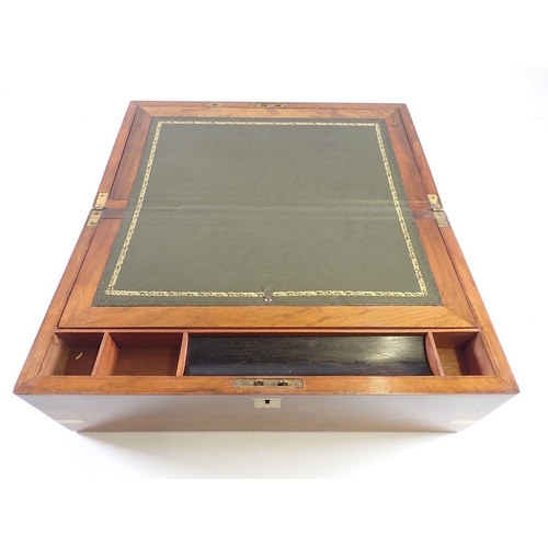 1166 - A 19th century walnut writing slope with fitted interior and brass mounts, 45cm wide