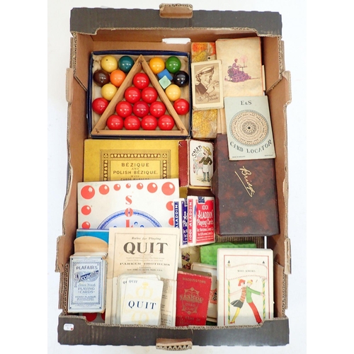 1175 - A box of vintage games including a set of children's snooker balls, bridge, Bezique, Solitaire etc.