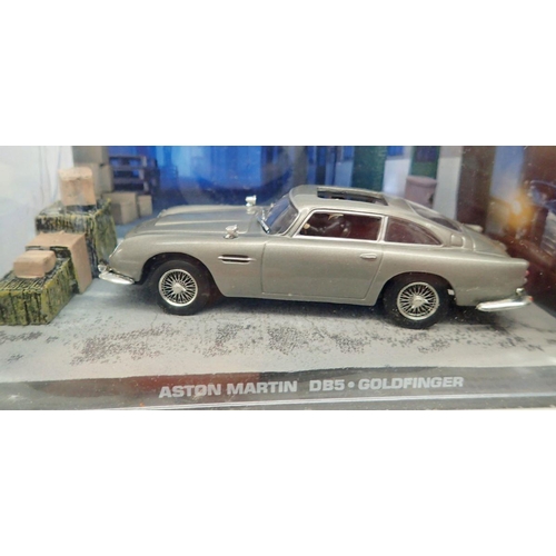 1181 - The James Bond Car Collection - group of twenty three model cars and magazine, cars all in original ... 