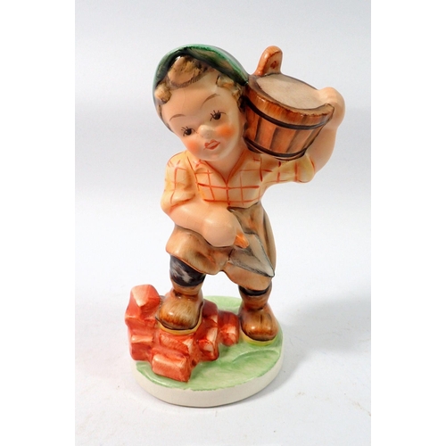 124 - A Friedel figure of a child builder, 15cm tall