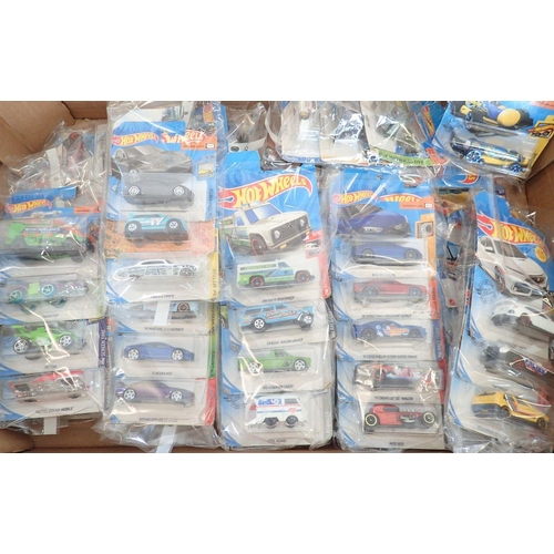 1245 - A box of Hot Wheels vehicles, all unopened in original packaging - over 70