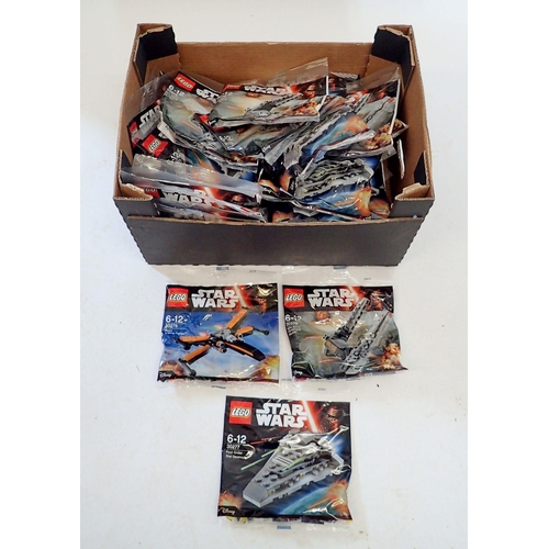 1255 - A box of forty six Lego Star Wars vehicles including multiples of Poe's X-wing fighter, Kylo Rens Co... 