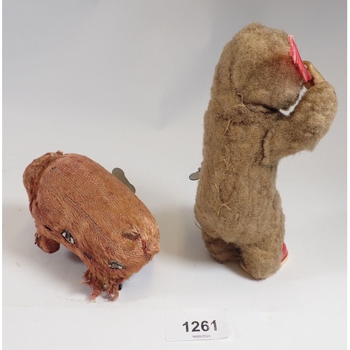 1261 - An early 20th century automaton toy monkey combing his hair and a clockwork bear - both reputed to b... 