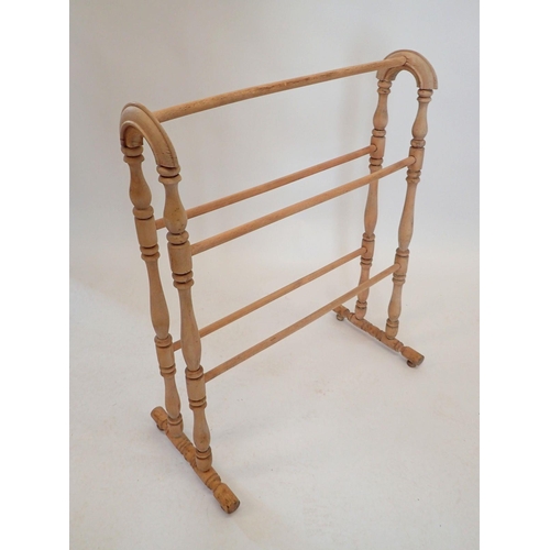 1285 - A lightwood towel rail, 63cm wide