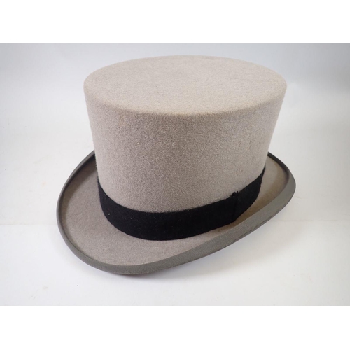 1293 - A Moss Bros. grey top hat in box, size 7