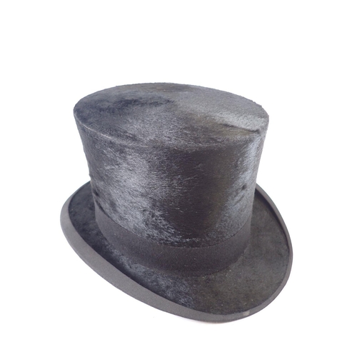 1295 - A Christy's silk top hat, size 7 1/8 in a 'Vulcanfibre' box, 56cm circumference approx.