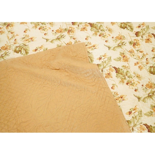 1306 - A late Victorian hand stitched Durham quilt with floral yellow and green fabric and plain gold fabri... 