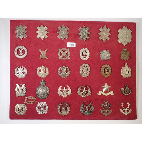 1316 - A framed display of thirty one Scottish cap badges (Please note - some badges may be re-strikes and ... 