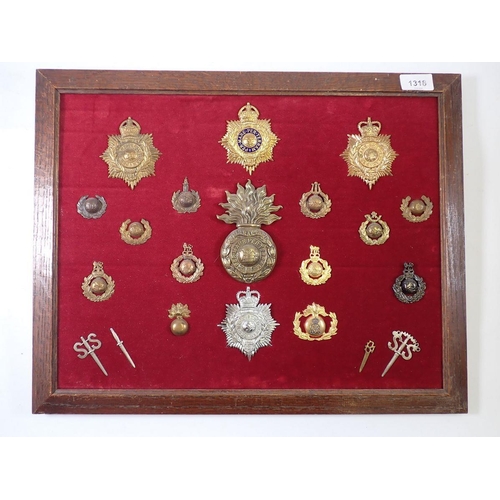 1318 - A framed display of twenty Special Forces military cap badges including Commando 55 badges and knuck... 