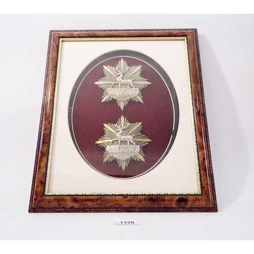 1326 - A framed display of two Hertfordshire Rifle Volunteer helmet plates (Please note - some badges may b... 