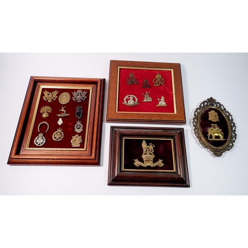 1328 - A framed display of ten Home Guard cap badges, a framed Royal Marines Helmet plate plus two other ba... 