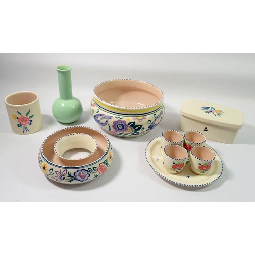 134 - A Poole group of china including butter dish, egg cups, posy ring etc.