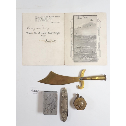 1347 - A brass WWI naval lighter and various other military collectables including postcard, trench art pap... 