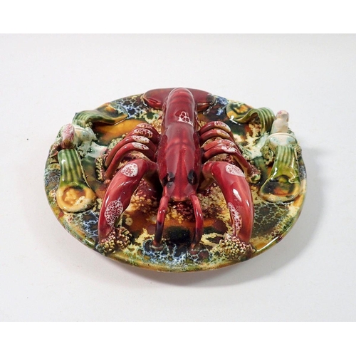 135 - A Palissy style lobster plate, 18cm diameter