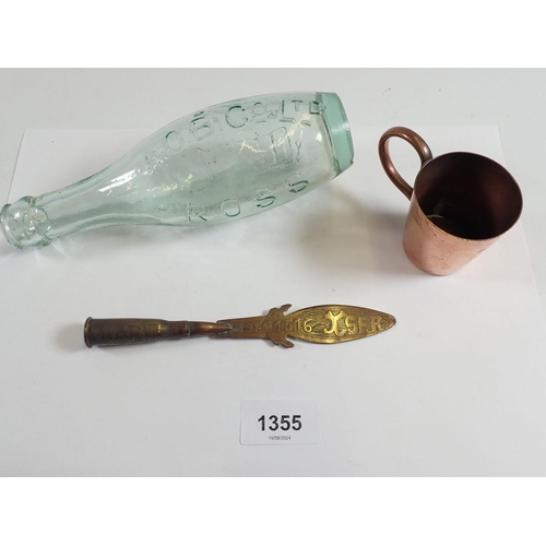 1355 - A copper Trench Art paperknife, a Royal Navy Copper measure with anchor mark to base and a glass bot... 