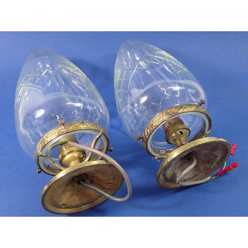 1380 - A pair of cut glass pear drop light fittings with gilt metal fittings, 24cm