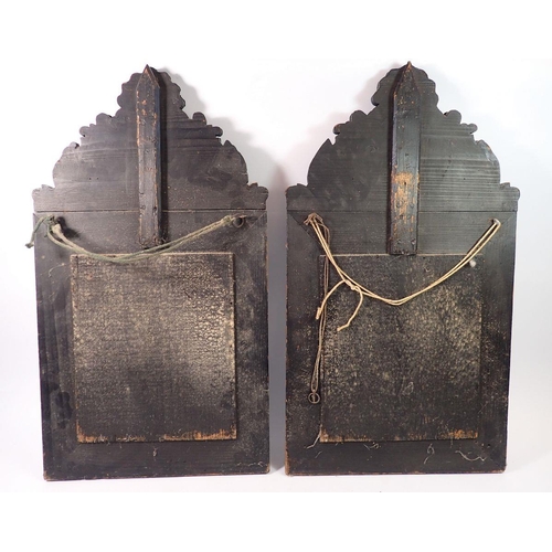 1389 - A pair of Flemish style patinated brass cushion framed mirrors, 59 x 33cm