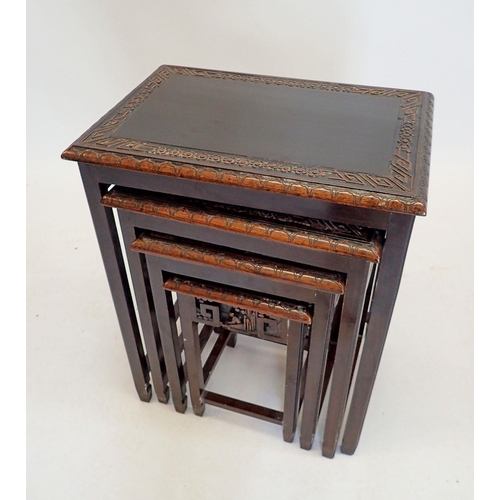 1393 - A nest of four carved hardwood occasional tables, 51 x 36 x 63cm