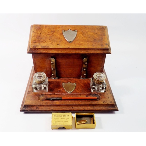 1395 - A Victorian oak correspondence box with rise top letter compartment and inkstand fitted two glass in... 