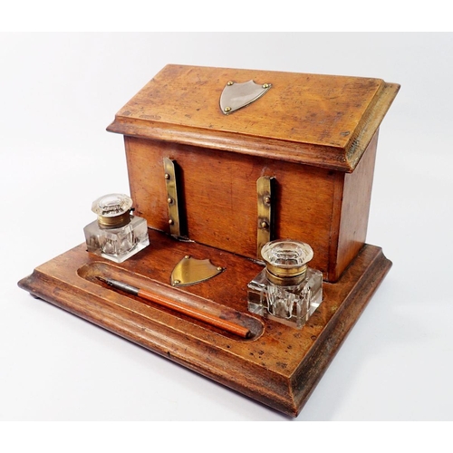 1395 - A Victorian oak correspondence box with rise top letter compartment and inkstand fitted two glass in... 