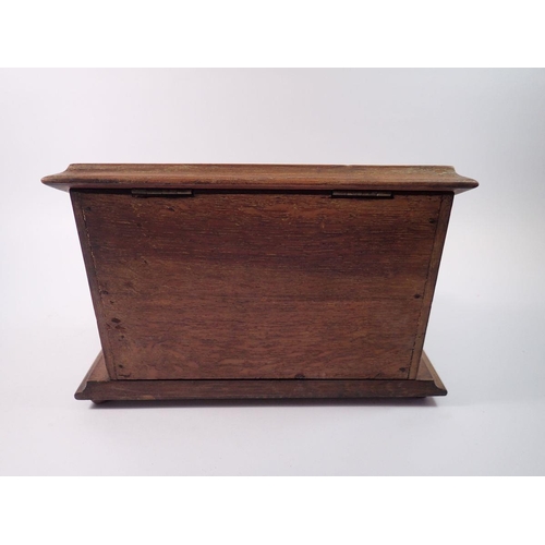 1395 - A Victorian oak correspondence box with rise top letter compartment and inkstand fitted two glass in... 