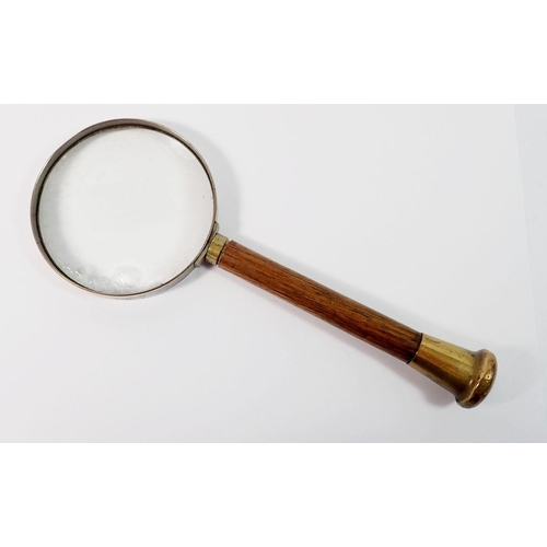 1397 - An old magnifying glass with wooden handle