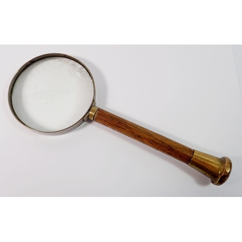 1397 - An old magnifying glass with wooden handle