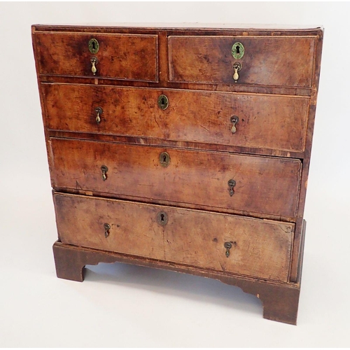 1398 - A George II walnut chest of two short and three long drawers on bracket supports, 86cm