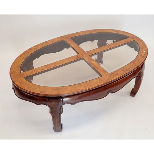 1402 - A Waring & Gillows oriental style oval coffee table with inset glass panels to top, 122 x 74 x 44cm