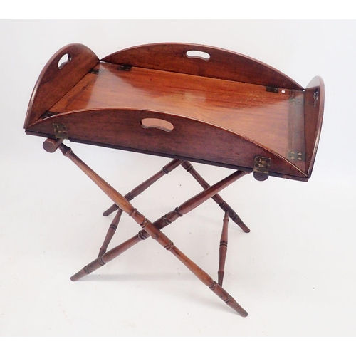 1417 - A Georgian mahogany butlers tray on turned wood stand