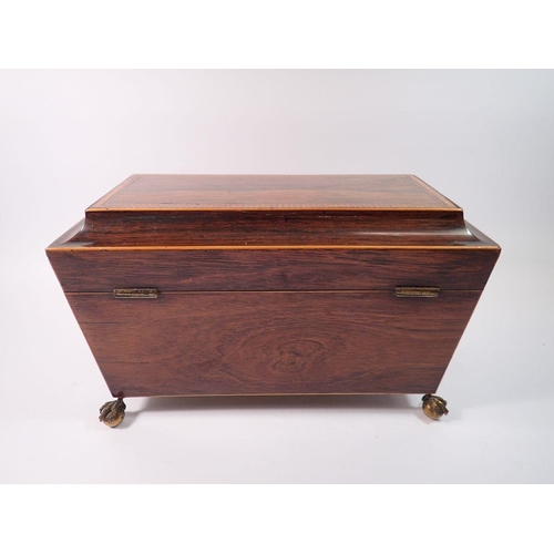 1418 - A 19th century rosewood inlaid tea caddy with fitted interior but no bowl, all on claw and ball feet... 