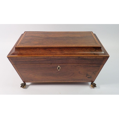 1418 - A 19th century rosewood inlaid tea caddy with fitted interior but no bowl, all on claw and ball feet... 