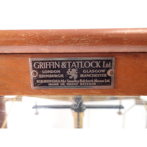 1420 - A Griffin & Tatlock set of balance scales in glazed case, 45cm wide