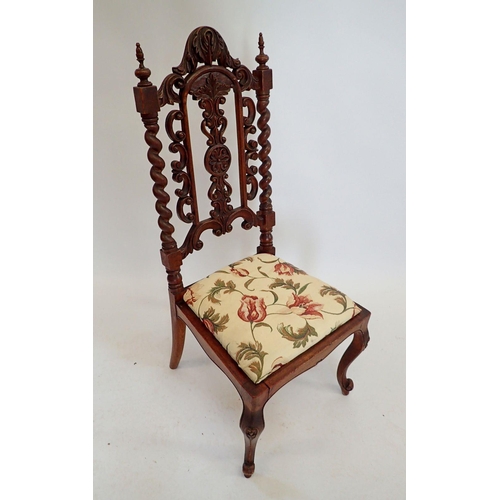 1434 - A Victorian small chair with ornately carved back